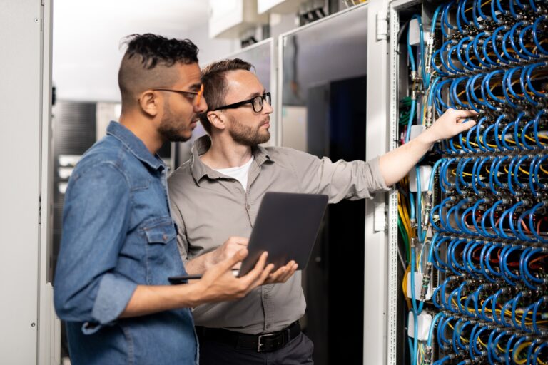Computer support specialists analyzing network problem