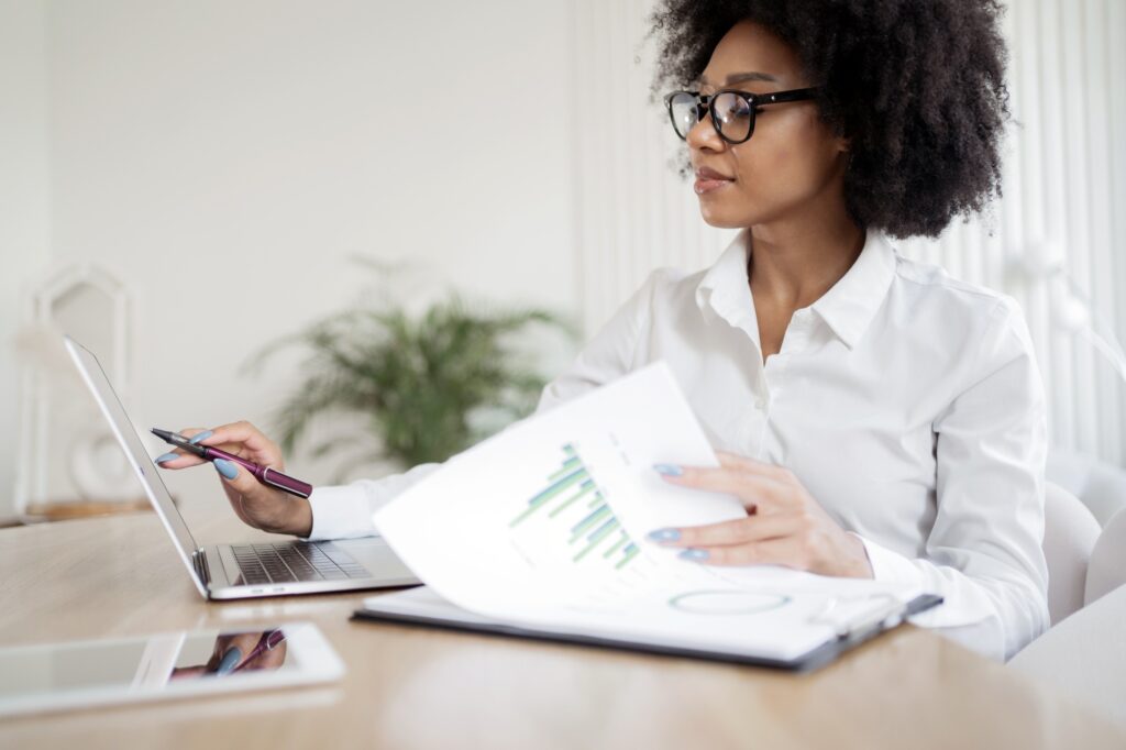 Routine work with documents in the office. Workplace in the office a female administrator